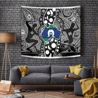 Decorative tapestry wall hanging with black, white, blue, and green patterned design
