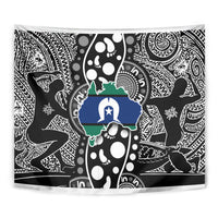 Rectangular tapestry wall hanging with bold black-and-white tribal motif and blue-green accents