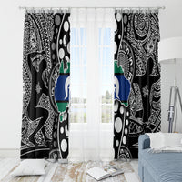 Black patterned window curtains with centered multicolor map graphic and white star