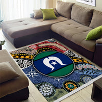 Multicolor tribal area rug with central circular emblem and decorative geometric border motifs