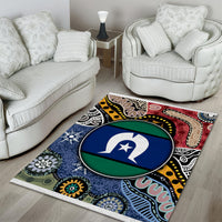 Multicolor patterned area rug with a central circular emblem and aboriginal-inspired shapes