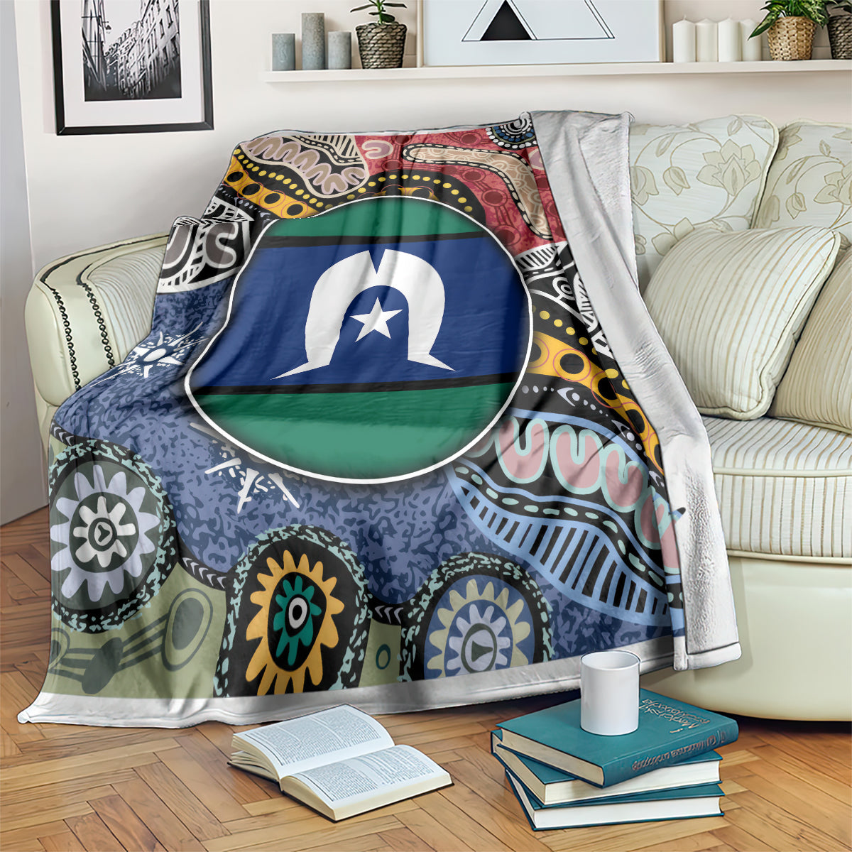 Multicolor aboriginal pattern blanket with circular flag-style emblem, draped on sofa
