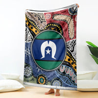 Multicolor aboriginal pattern blanket with circular flag-style emblem, upright on floor