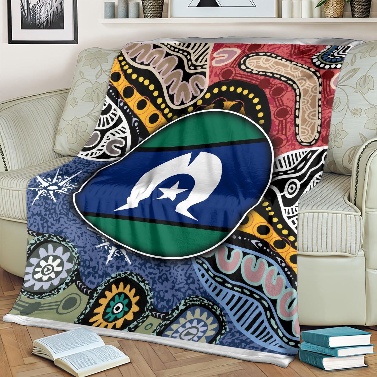 Multicolor aboriginal pattern blanket with circular flag-style emblem, close-up on sofa