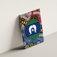 Multicolor Aboriginal patterned canvas wall art with circular blue-and-green emblem on wall.