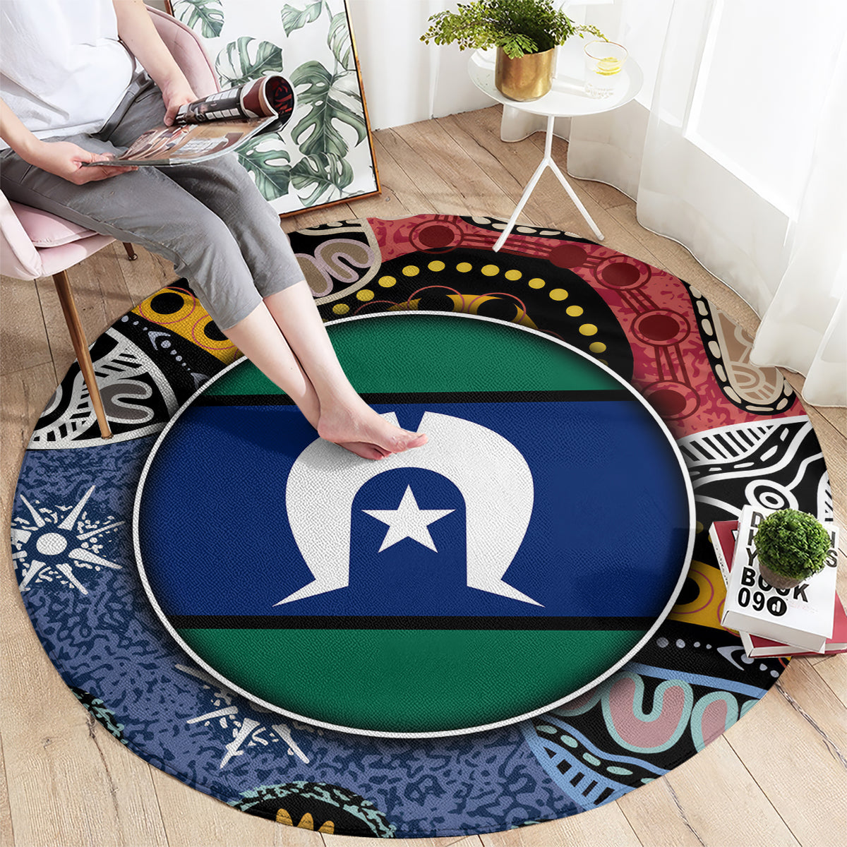 Round area rug being placed; central flag-style emblem in blue and green with multicolor border