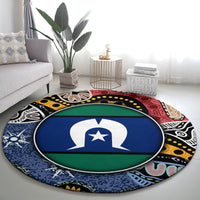 Round area rug with central flag-style emblem, blue/green center and multicolor abstract border