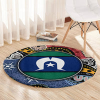 Round area rug with central blue-and-green emblem and multicolor abstract border, circular shape