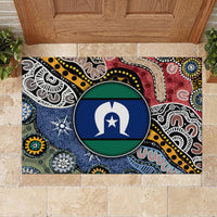 Multicolor rubber doormat with large round emblem over intricate tribal lines near doorway