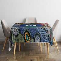 Rectangular tablecloth with multicolor Aboriginal pattern, blue and teal base, round table look