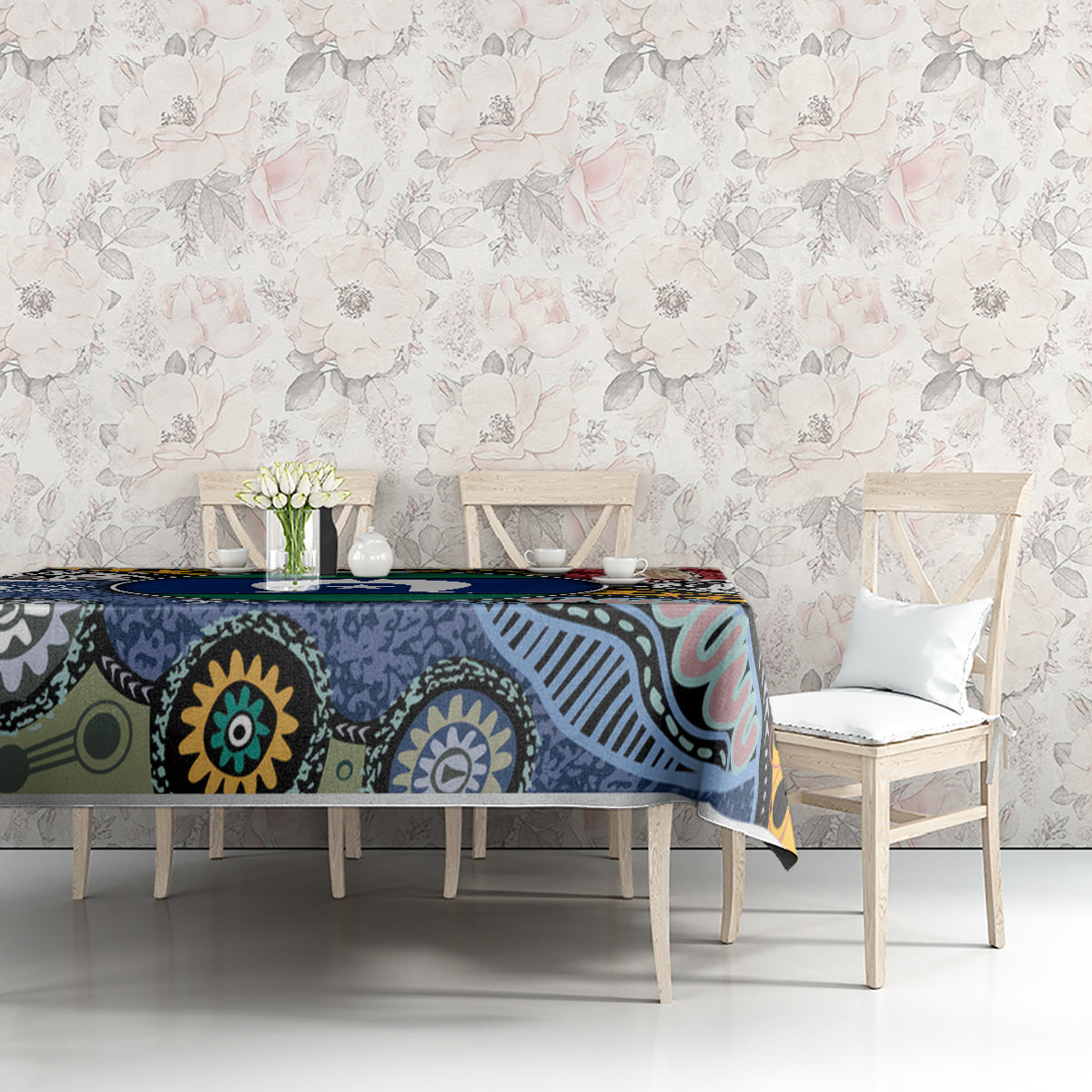 Rectangular tablecloth with multicolor Aboriginal island motifs along dining table edge