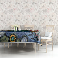Rectangular tablecloth with multicolor Aboriginal island motifs along dining table edge
