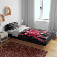 Black and red duvet cover with coral reef turtle artwork and slogan across the bed
