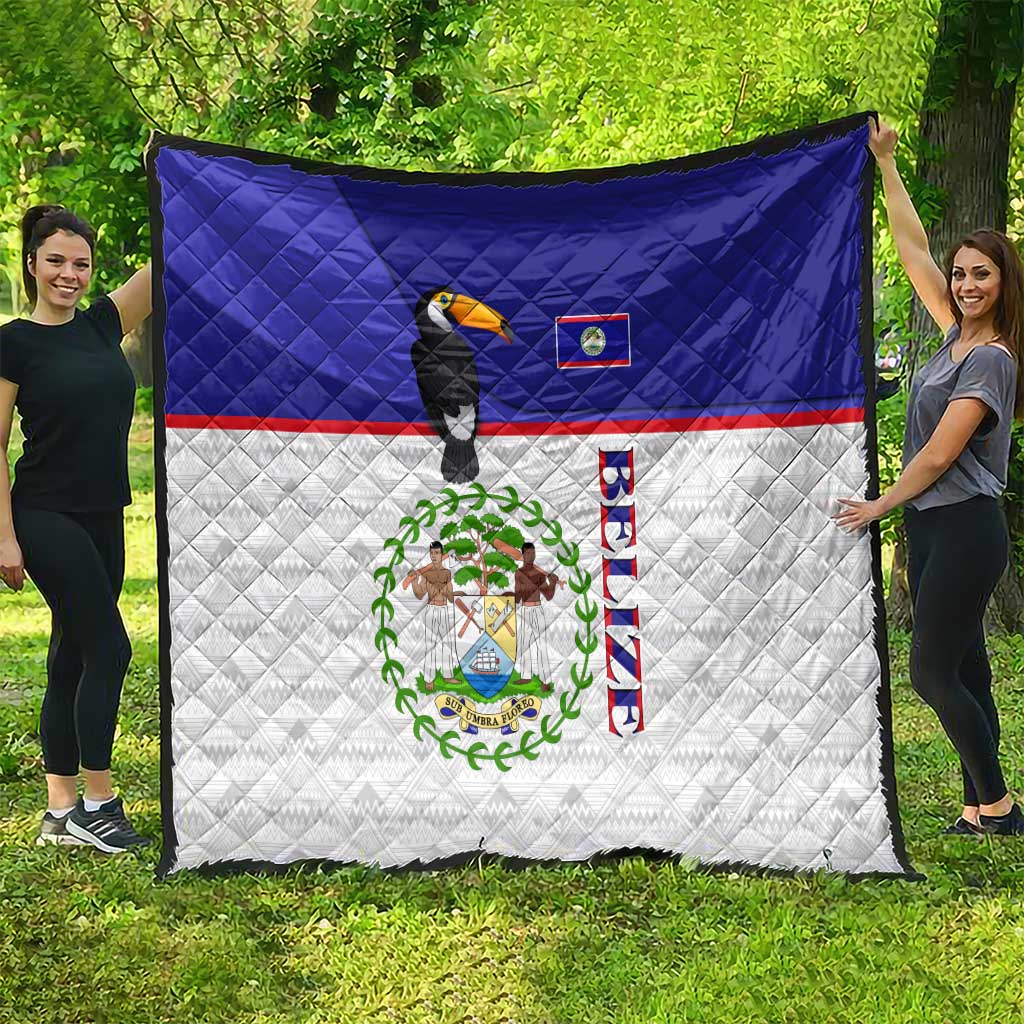 Belize-themed blue and white quilt featuring toucan bird and national coat of arms