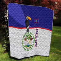 Blue and white quilt with diagonal flag stripes, toucan, and Belize emblem center