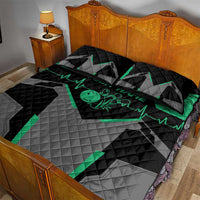 Black and gray quilt bed set with green bowling pin heart motif and heartbeat line