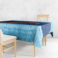 Blue ocean-wave tablecloth with red crab coral reef print along table edge