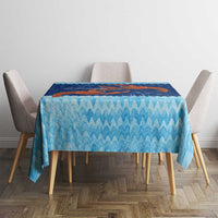 Blue coral reef tablecloth with red crab centerpiece and wavy water pattern