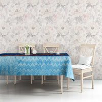 Blue wavy water tablecloth with red crab and coral reef design on dining setup