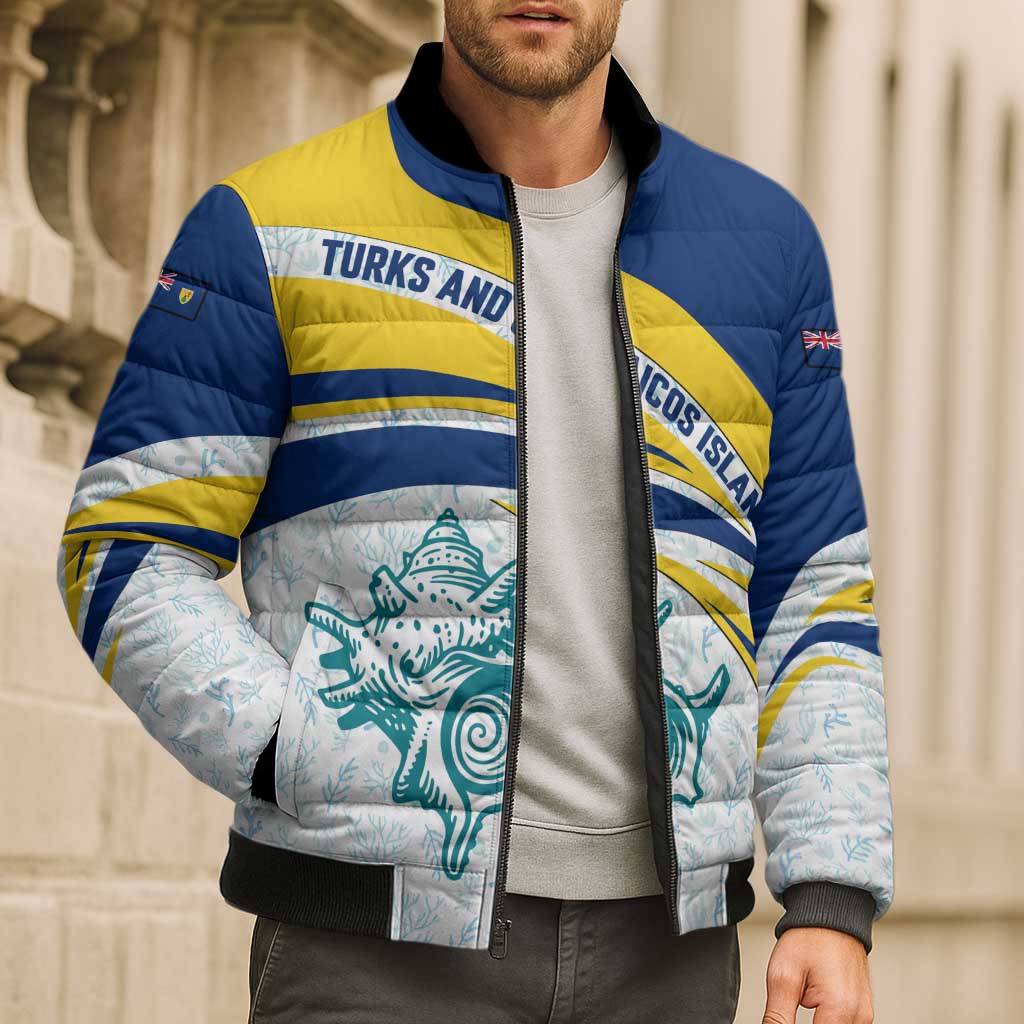 Navy and yellow puffer bomber jacket with sea creature graphic, full-zip and ribbed cuffs.