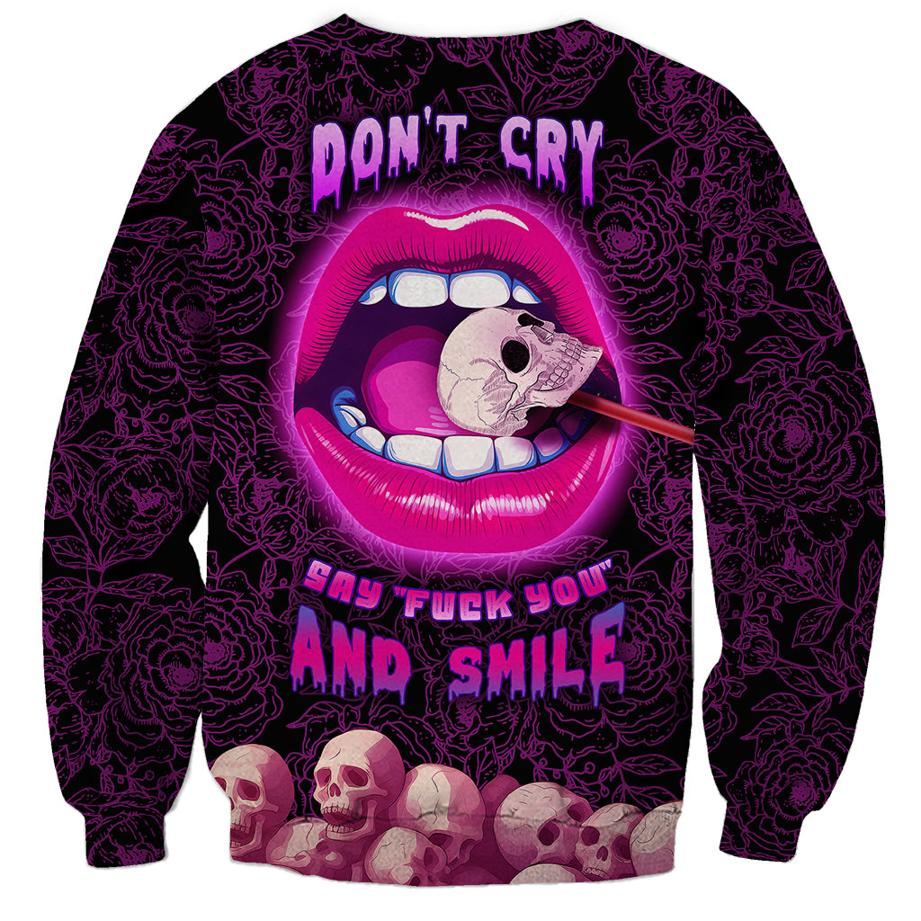 Unisex dark purple sweatshirt with pink cartoon lips, skull face, and bold 'Don't Cry' text