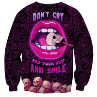 Unisex dark purple sweatshirt with pink cartoon lips, skull face, and bold 'Don't Cry' text