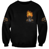 Black unisex sweatshirt with small flaming skull emblem and flame-like hand graphics on sleeves
