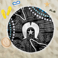 Round beach blanket with fringed edge, black-and-white tribal pattern and blue dot accents
