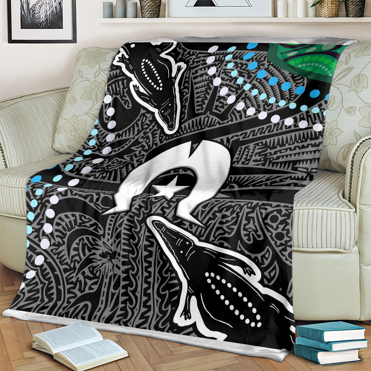 Aboriginal pattern blanket featuring large animal graphic and star emblem in black, white