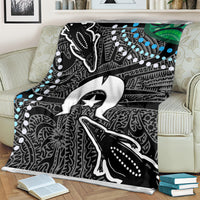 Aboriginal pattern blanket featuring large animal graphic and star emblem in black, white