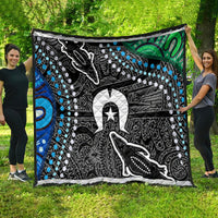 Multicolor patterned quilt draped outdoors, featuring black-and-white animal art with blue dot accents