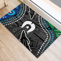 Black rubber doormat with white star graphic, blue dot accents, and green side border