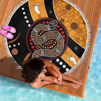 Round beach blanket with fringed edge, multicolor Aboriginal snake and paw print pattern