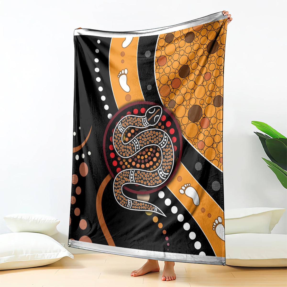 Multicolor snake dot art blanket with orange circular dot section and paw accents.