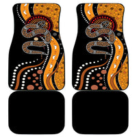 Set of car floor mats with multicolor snake dot artwork on two mats, black mats included