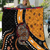 Snake-pattern dot art quilt with black, orange, red, and white designs and paw prints