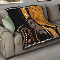 Living room throw quilt with black-and-orange snake artwork, dot accents, and paw prints