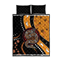 Quilt bed set with black and orange snake dot pattern; includes two pillow shams