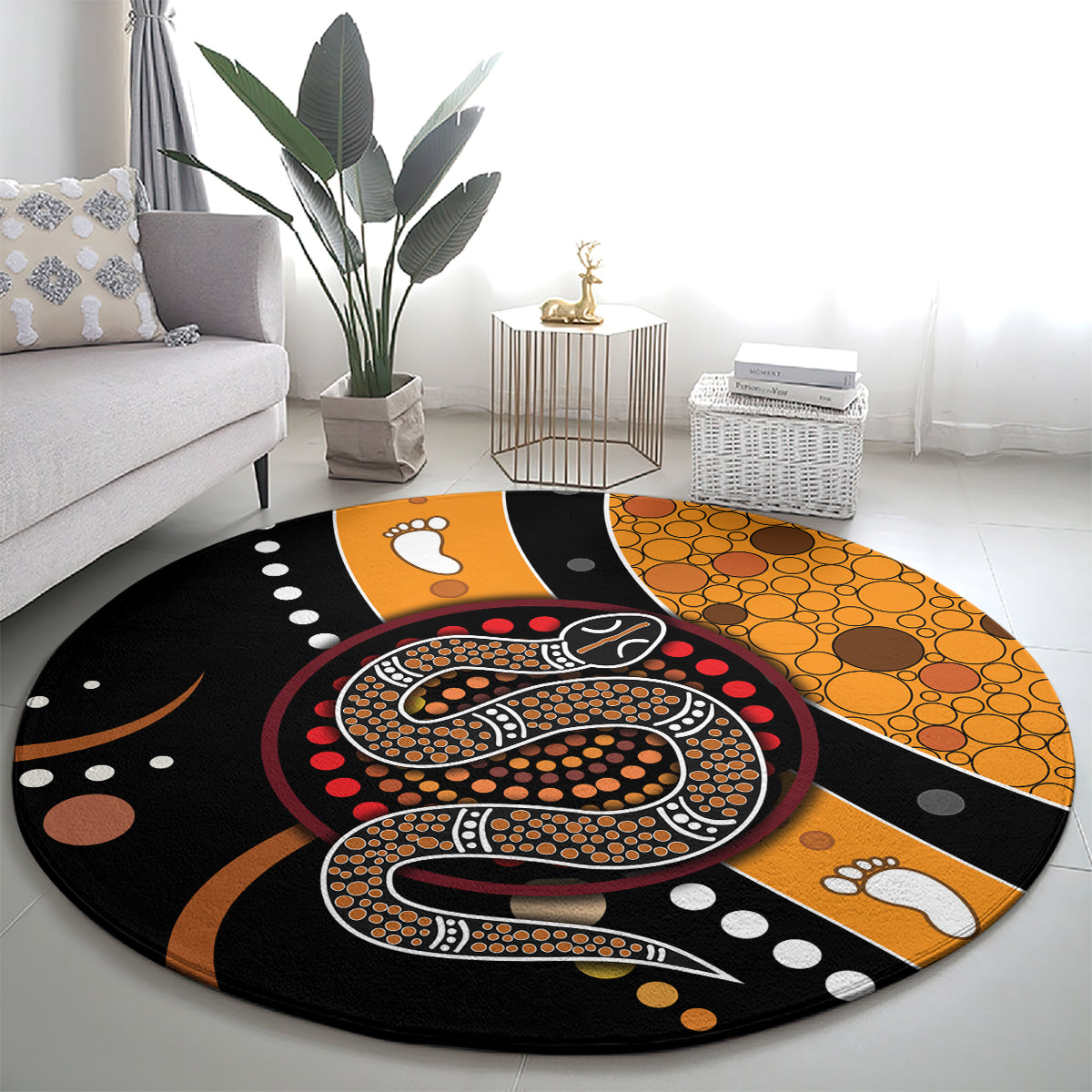 Round area rug featuring a large Aboriginal snake dot design in black, orange and red