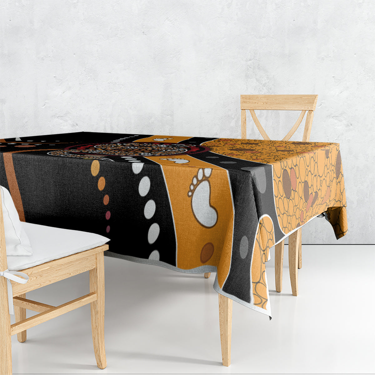 Multicolor snake dot art tablecloth on table, black and orange circular motifs with dots