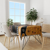 Multicolor snake dot art tablecloth on dining set, black and orange with white dot accents