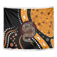 Multicolor snake-pattern dot art tapestry close-up with coiled serpent and orange dot texture.