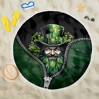 Round beach blanket with white fringe, green zipper-style leprechaun graphic center