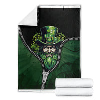 Folded green zip-art blanket with Irish man top-hat portrait and zipper-trim edge