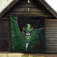 Green and black quilt with zipper trim and leprechaun artwork, hanging outdoors