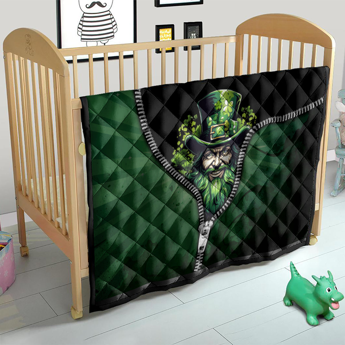 Green and black quilt with zipper trim and leprechaun face graphic on wooden crib