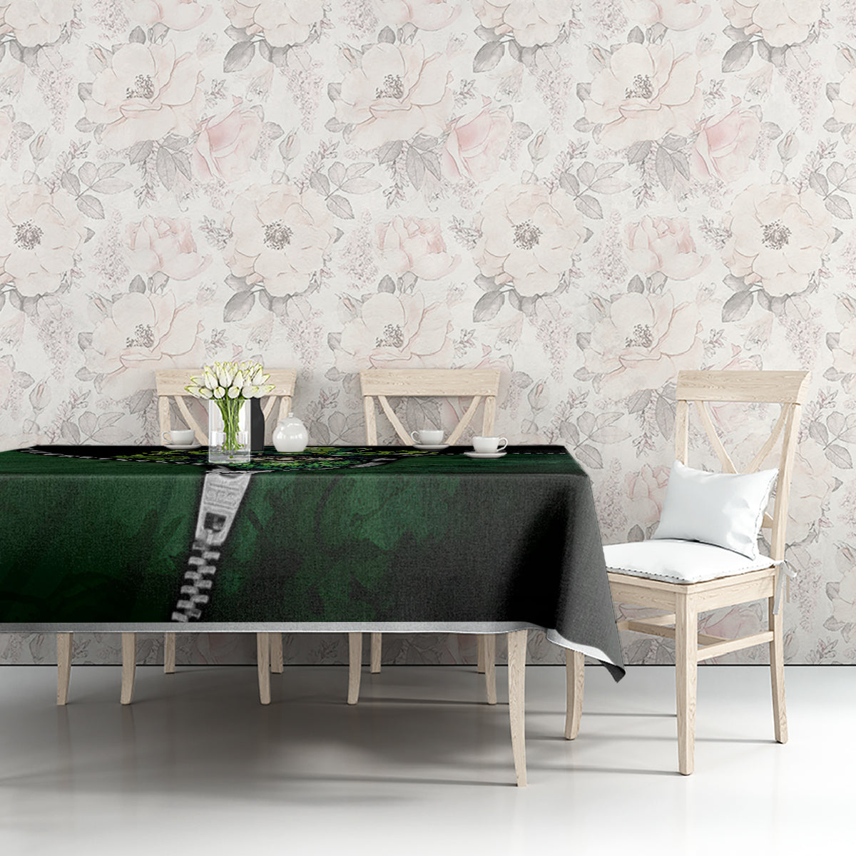 Green and black 3D zip-art tablecloth on a table, featuring a multicolor zipper-style graphic.