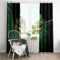 Black and green curtain panels with leprechaun heads flanking the center and white zip trim