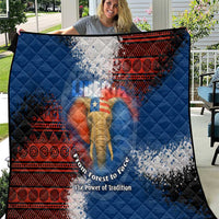 Blue quilt with red tribal border and central elephant graphic, quilted diamond pattern