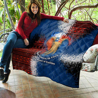 Blue quilt with red tribal design and elephant graphic, laid out on patio seating